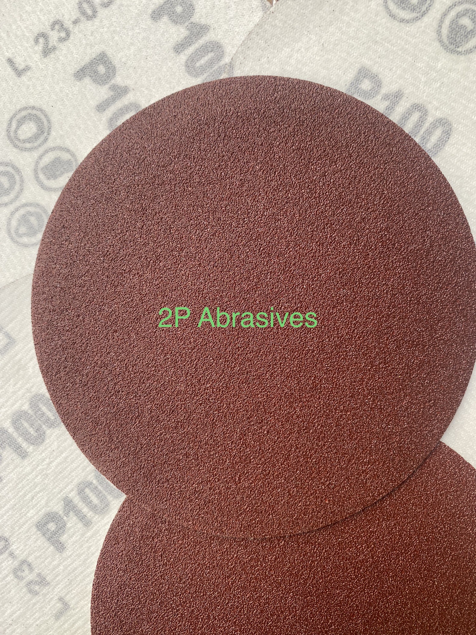 Round sandpaper with red sand feathers